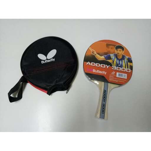 a tennis racket and a tennis racket on a table.