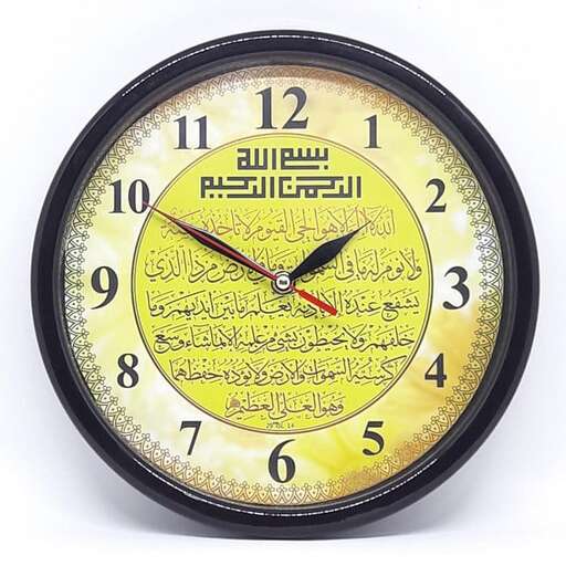 a clock with a black face and a yellow face.