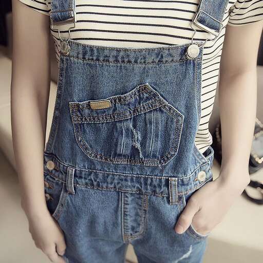 a boy in a striped shirt and jeans