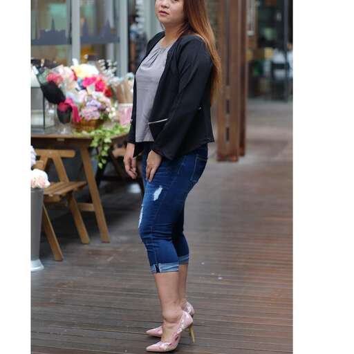 person in a black blazer and jeans