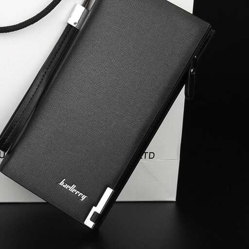 a black and white photo of a notebook and a pen.