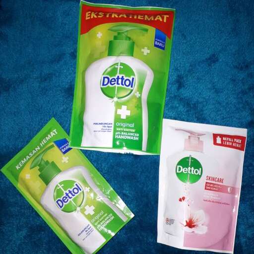 a package of lotion and a bottle of lotion.