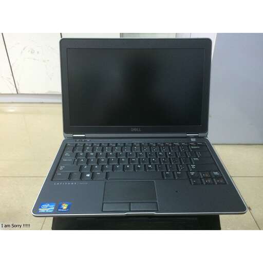 a laptop computer sitting on top of a table.