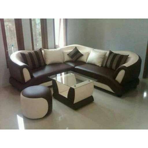 a modern living room with a leather sofa and a coffee table.