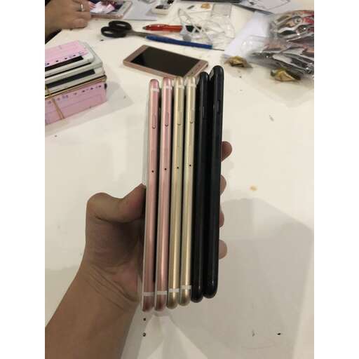 a person holding a cell phone in their hand.