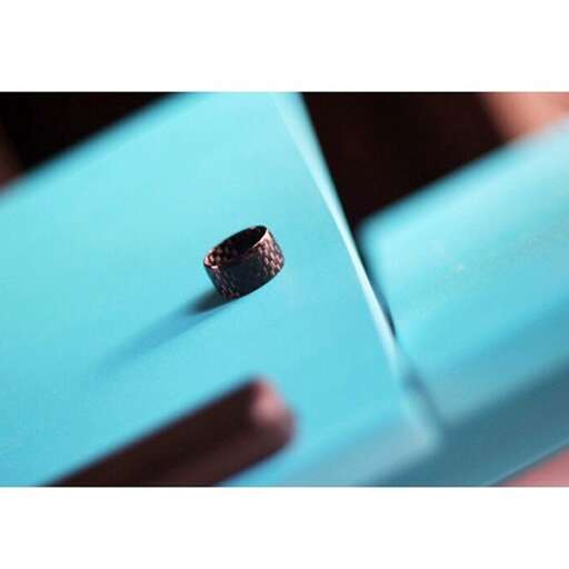 a small hole in the blue car
