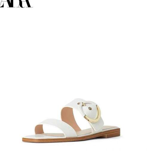 a pair of sandals with a gold buckle and a white sandal.