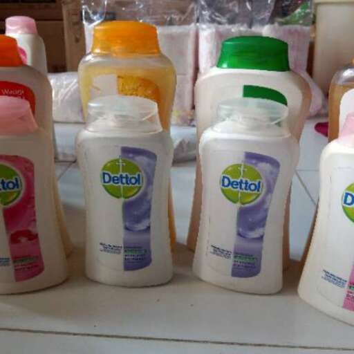 a table topped with bottles of shampoo and conditioner.