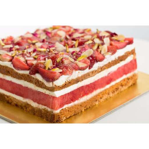 a cake with strawberries and cream cheese frosting.