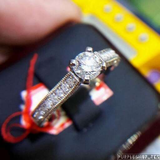 a close up of the ring and wedding band.