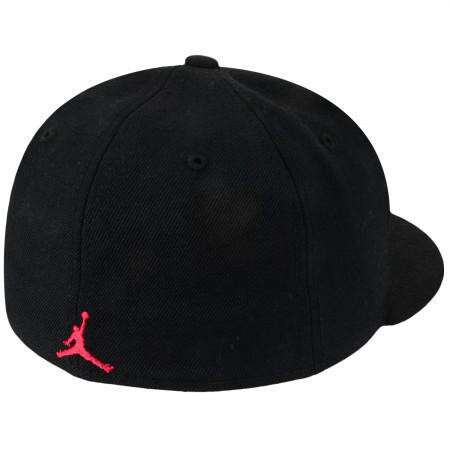 baseball cap with a red logo
