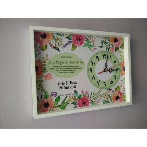 a clock with flowers on it.
