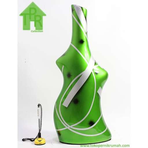a green dress with a white strap