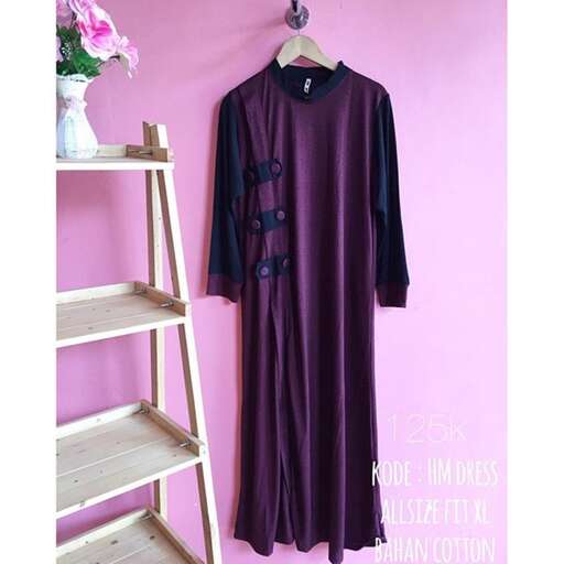 a purple dress with buttons on the front.