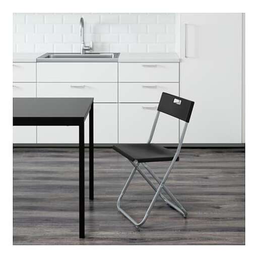 a chair that is sitting in front of a table.