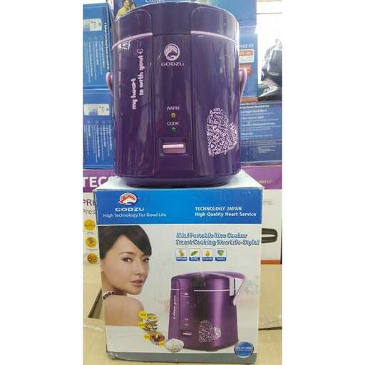 a purple and black coffee maker on display.