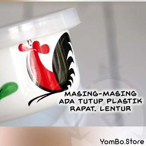 a bottle of red and green liquid with a black background.