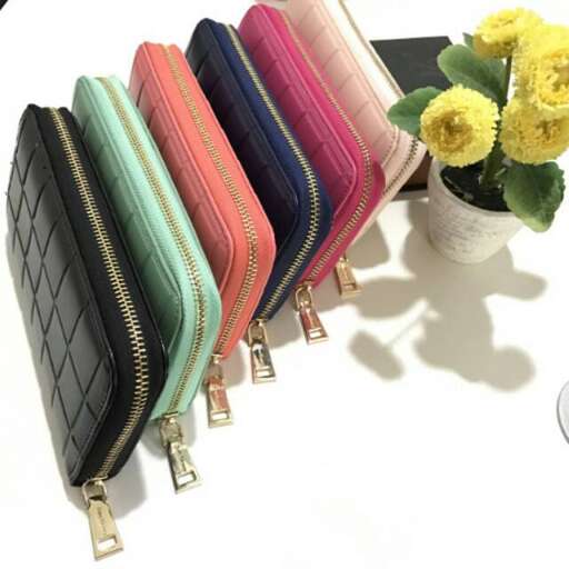 a small purse with a bunch of different colored bags