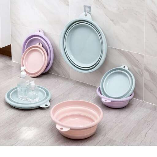 a set of colorful toilets in a bathroom.
