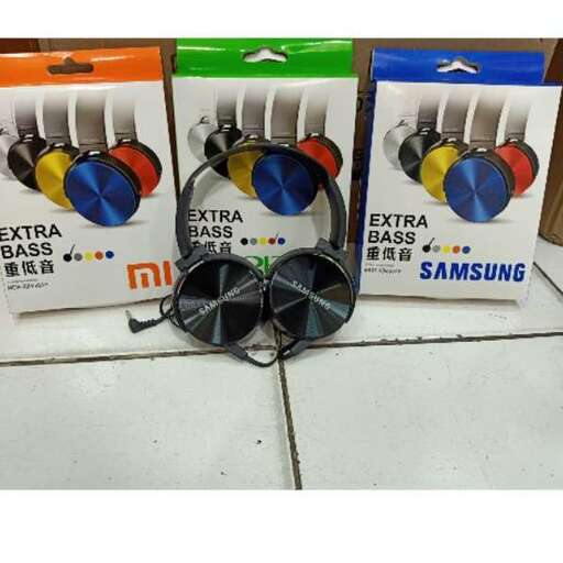 a pair of headphones on a white tile floor.