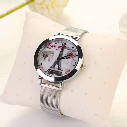 a watch with a watch on a pillow