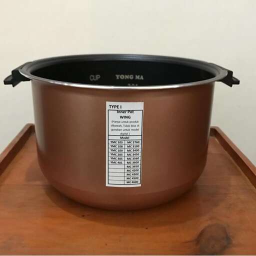 a large pot with a lid on the lid.