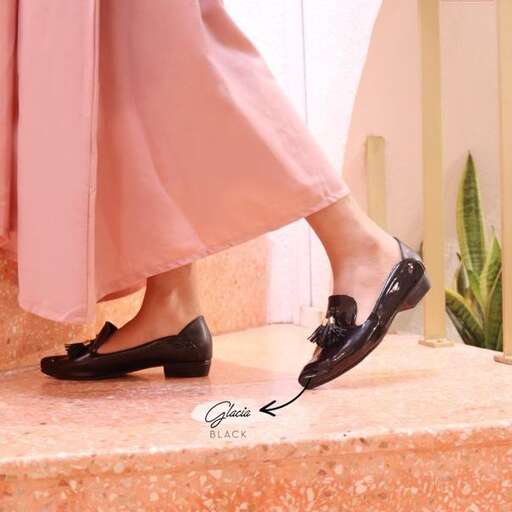 a pair of shoes with a pink dress.