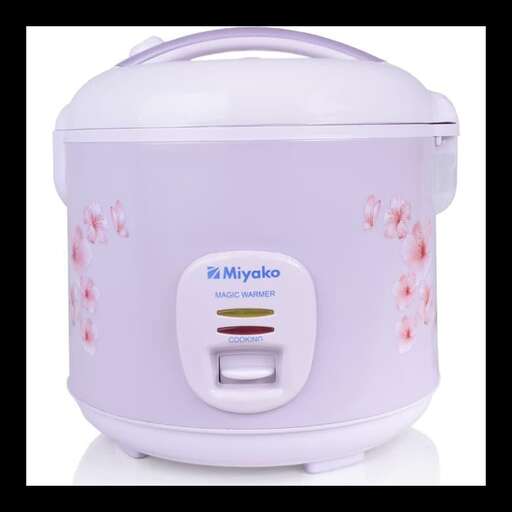 a pink crock pot with a lid on it.