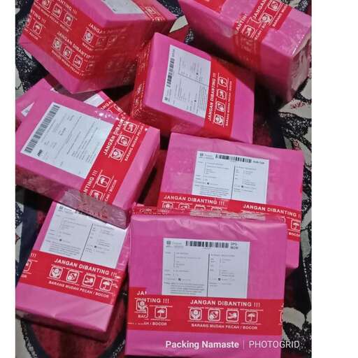 the pink boxes are in the middle of the street.