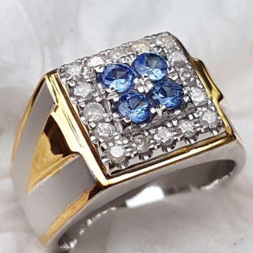 a ring with a sapphire and diamonds.