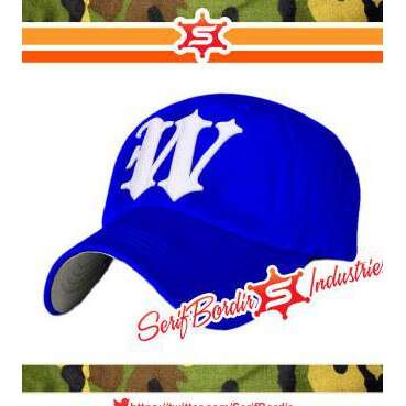 blue hat with orange trim and white letters. logo by j. s. j.