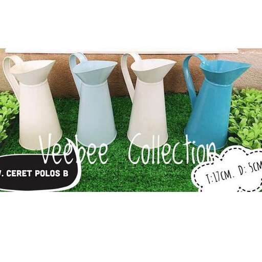 a collection of vases and vases on a grass lawn.