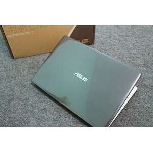 a laptop computer sitting on a carpeted floor.