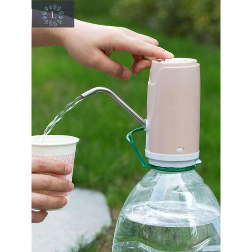 a hand is holding a bottle of water.