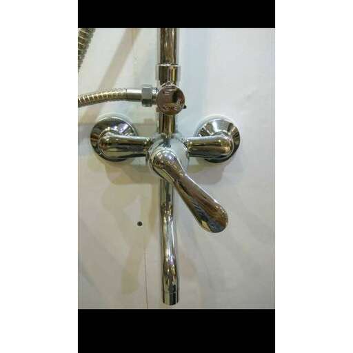 a metal faucet in a bathroom