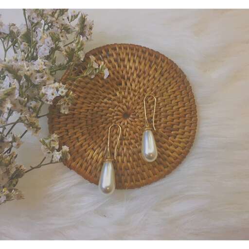 a basket with a flower and a vase of flowers.