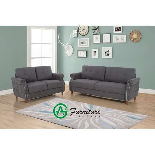 a living room with a couch and a window.