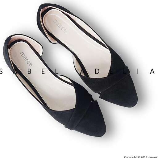 a pair of black flat shoes with a bow on the bottom.