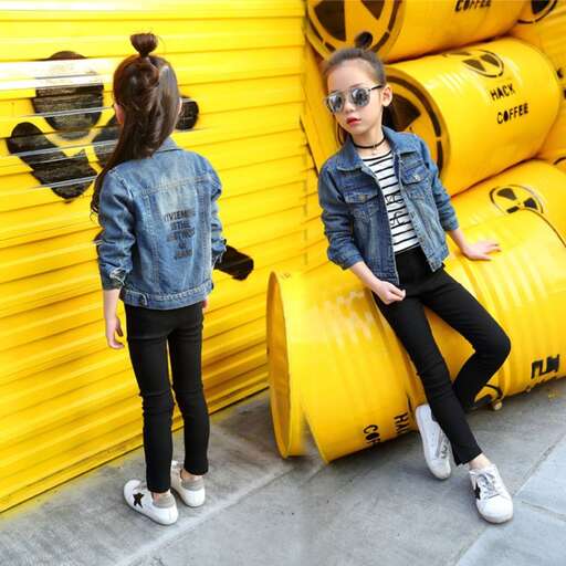 girls in front of a big yellow wall