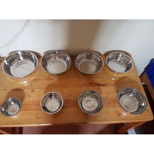 a table with four bowls and bowls on it.