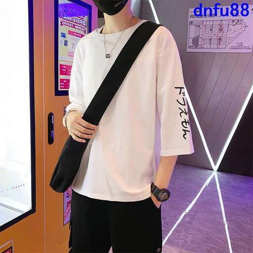 a white t - shirt with black print on the front and the sleeves.