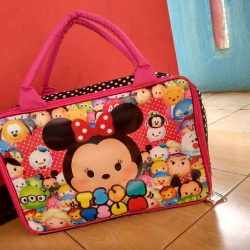 a pink bag with mickey mouse ears and a mickey mouse bag.