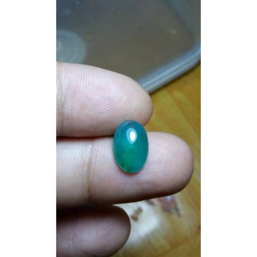 a green glass bead made by my son.