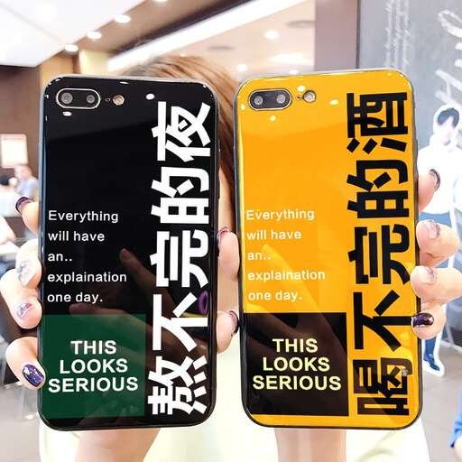 a person holding a phone in their hands.