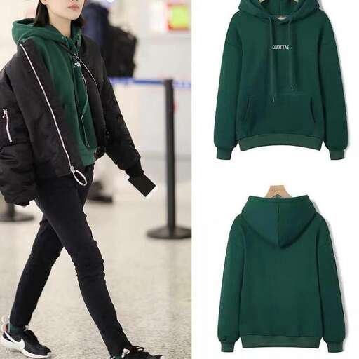a model in a green hoodie and black jeans