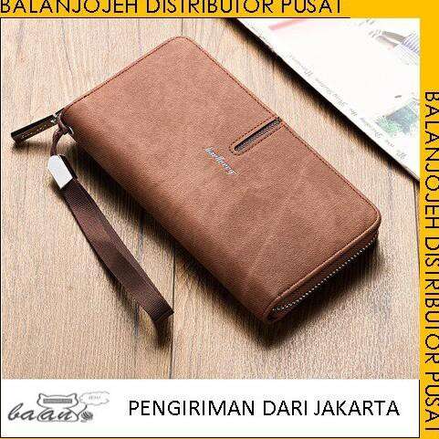a brown leather wallet sitting on top of a wooden table.