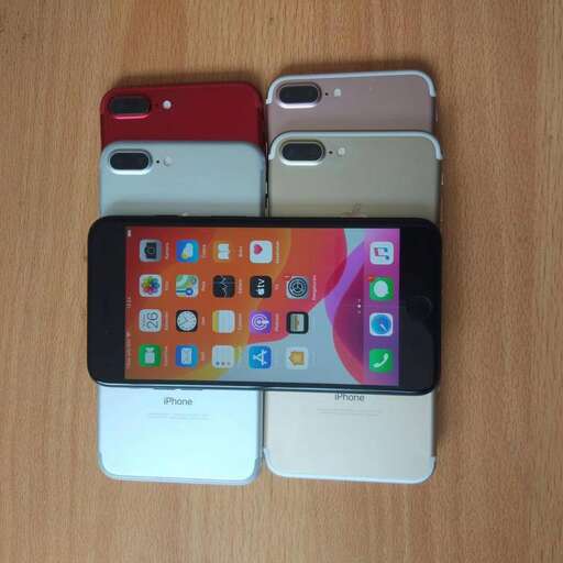 three different cell phones are stacked on top of each other.