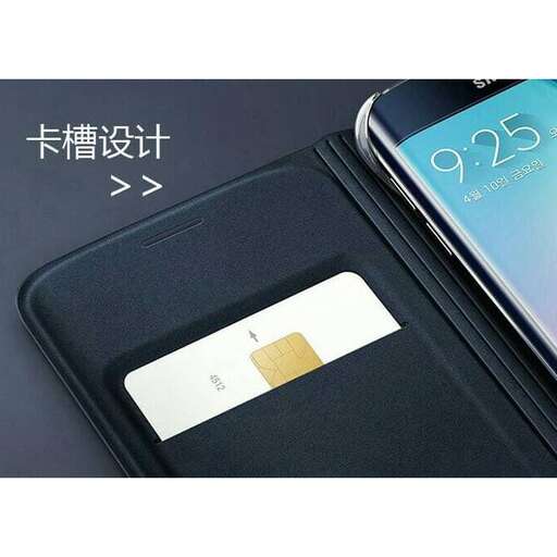 a cell phone with a note on the front of it.