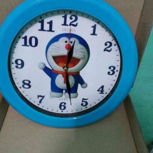 a clock with a cartoon cat on it.