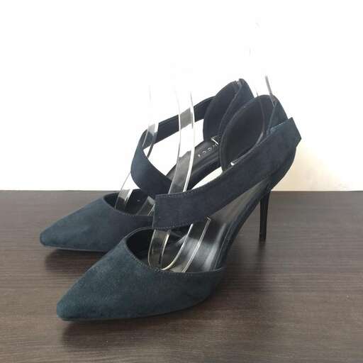 a pair of black suede shoes with a metallic finish.